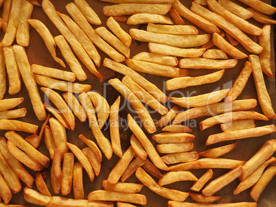 Golden French fries on a baking sheet