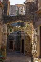 Beautiful old stone arcs in Spanish ancient village, Pals, in Costa Brava