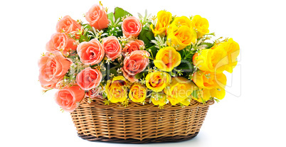 Silk red and yellow flowers in basket isolated on white backgrou
