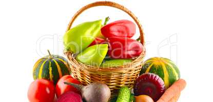Set of vegetables in wicker basket isolated on white. Wide photo