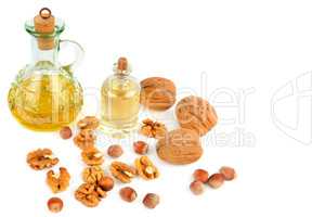 Oil of walnut and hazelnut, nuts isolated on white background.