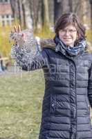 Woman holds ice piece in hand