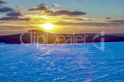 Snow landscape with sunset