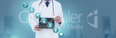 Doctor holding tablet with medical interface hexagon icons