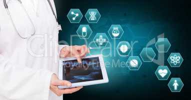 Doctor holding tablet with medical interface hexagon icons over world map