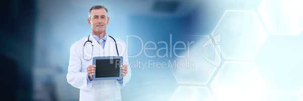 Male doctor holding tablet