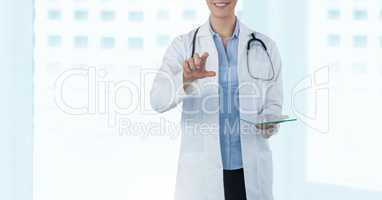 Female doctor holding tablet