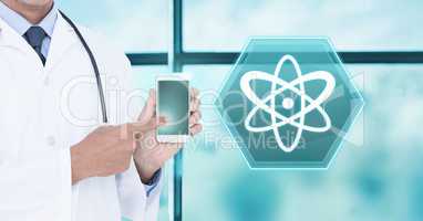 Doctor holding tablet with medical science interface hexagon icon