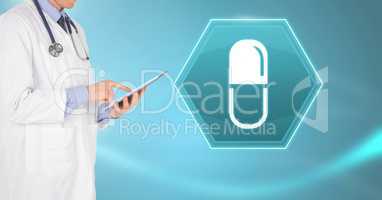 Male doctor holding tablet with medicine pill drug interface hexagon icon