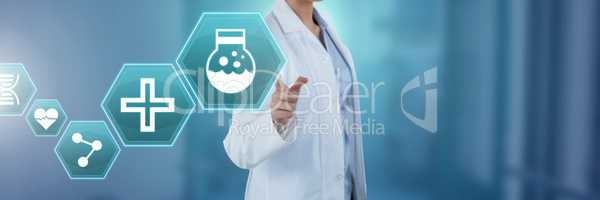 Female doctor interacting with medical hexagon interface