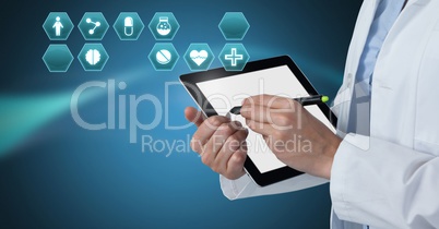 Doctor holding tablet with medical interface hexagon icons