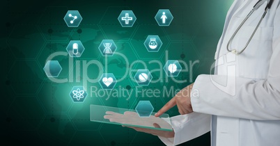 Doctor holding tablet with medical interface hexagon icons over world map