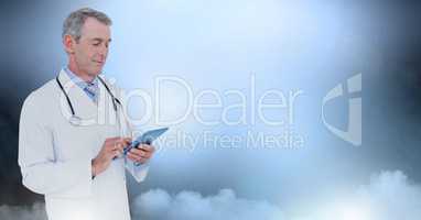 Male doctor holding tablet