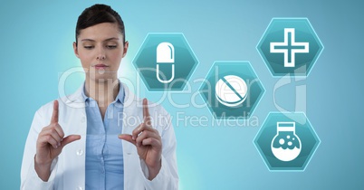 Female doctor holding tablet with medicine drugs interface hexagon icons