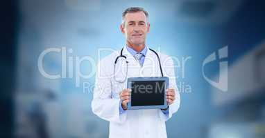 Male doctor holding tablet