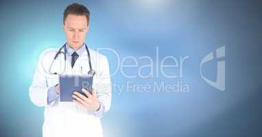 Male doctor holding tablet