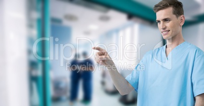 Male doctor interacting with air touch