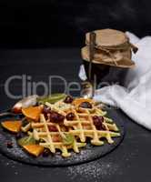 baked Belgian waffles with jam and fresh fruits