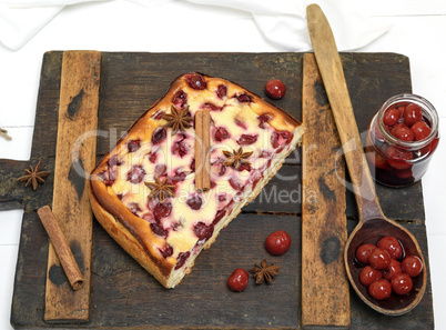 cottage cheese and cherry pie on a brown wooden board