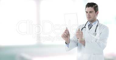 Male doctor holding tablet