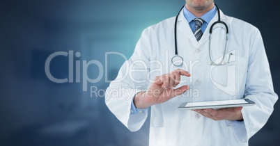 Male doctor holding tablet