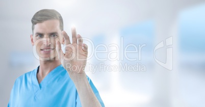 Male doctor interacting with air touch