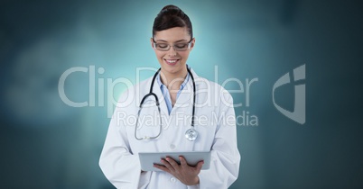 Female doctor holding tablet