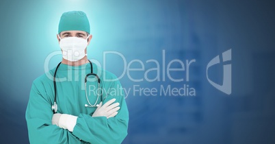 Doctor folding arms and wearing surgical mask