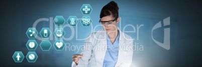 Male doctor holding tablet with medical interface hexagon icons