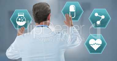 Male doctor interacting with medical hexagon interface