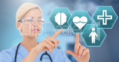 Female doctor interacting with medical hexagon interface