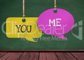 You Me text on hanging paper speech bubbles