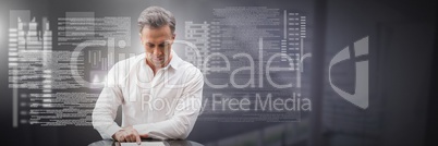 Businessman working on laptop with screen text interface