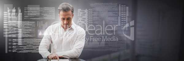 Businessman working on laptop with screen text interface