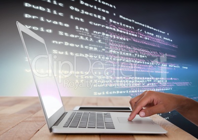 Hand using laptop with coding text Hand using laptop with coding text