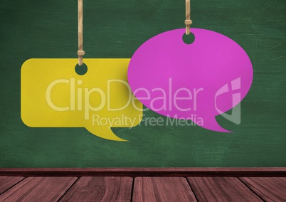 Hanging paper speech bubbles and blackboard background