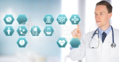 Male doctor interacting with medical hexagon interface