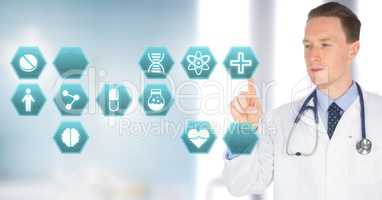 Male doctor interacting with medical hexagon interface