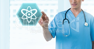 Male doctor interacting with medical science hexagon interface