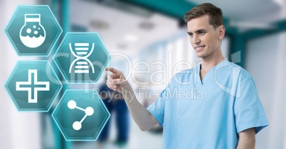 Male doctor interacting with medical hexagon interface