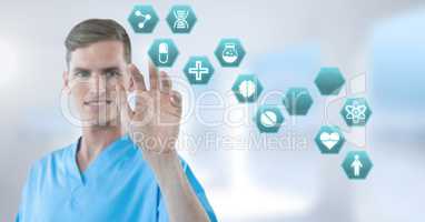 Male doctor interacting with medical hexagon interface