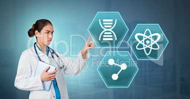 Female doctor interacting with medical hexagon interface