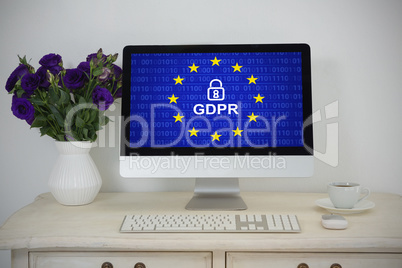 Composite image of desktop pc, vase and coffee on table