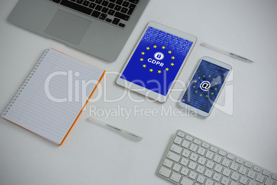 Composite image of various electronic gadgets and book on white background