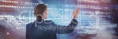 Composite image of rear view of businessman gesturing during presentation
