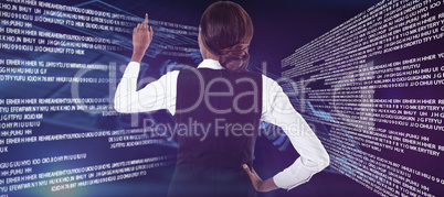 Composite image of rear view of businesswoman with hand on hip using invisible interface