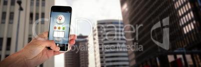 Composite image of cropped image of person holding mobile phone