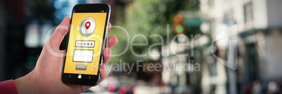 Composite image of close-up of man holding mobile phone