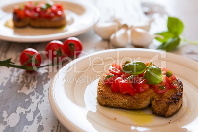 Closeup of Italian bruschetta with tomato and basil