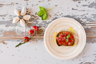Italian bruschetta with tomato and basil seen from above